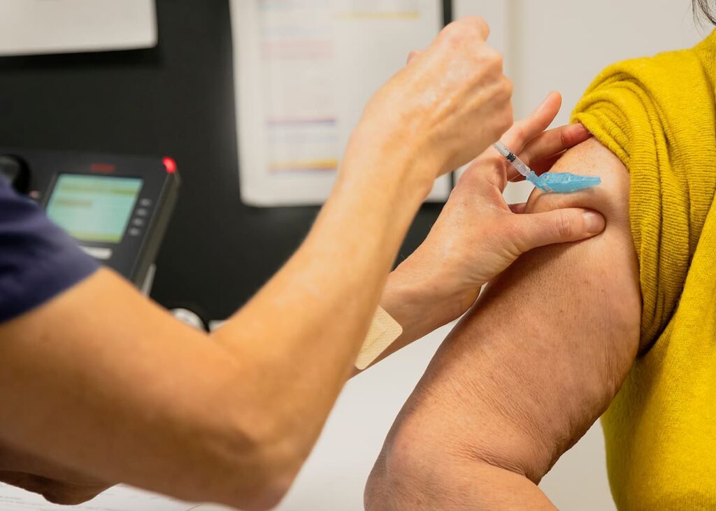 A doctor giving vaccinations in Miami, FL